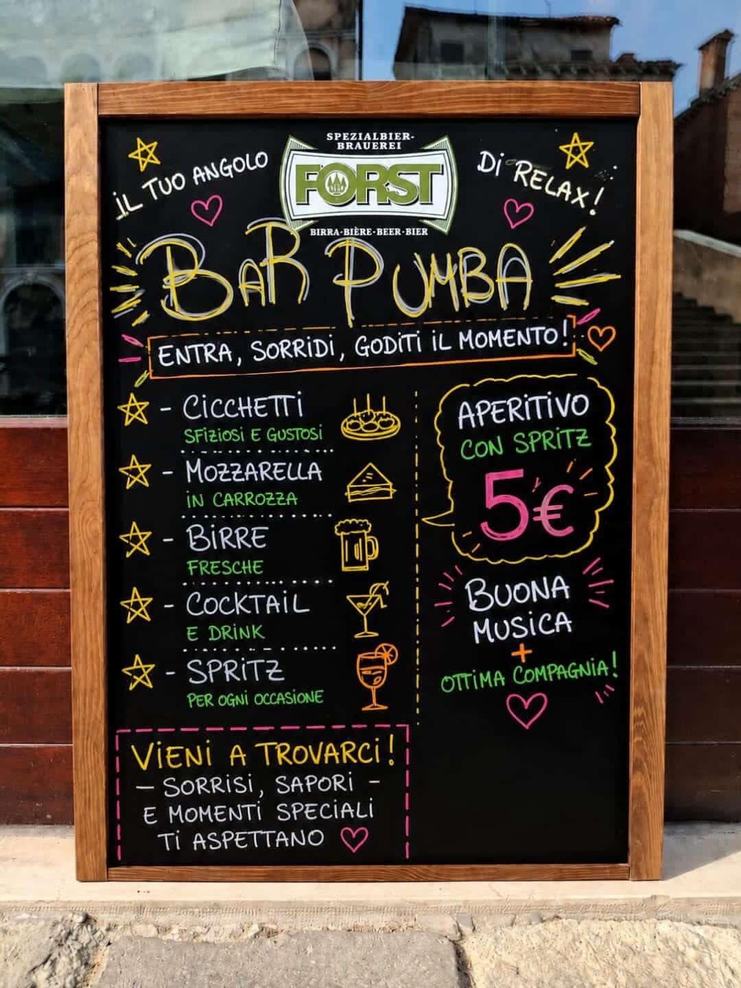 Bar Pumba chalkboard welcoming guests for aperitivo