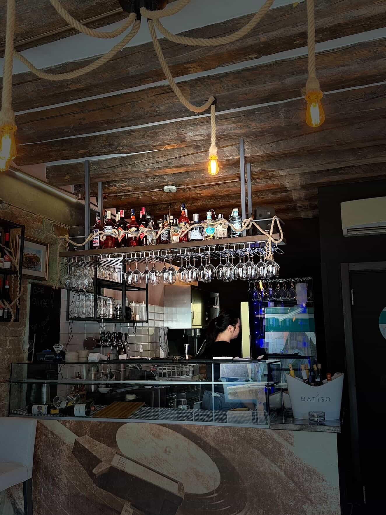 Cozy bar interior with rope-rigged wooden ceiling